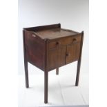 A 19th century mahogany tray-top cabinet fitted frieze drawer above a pair of panel doors, & on