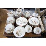 A Japanese porcelain extensive thirty-eight piece part tea service with figure scene decoration,