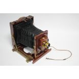 A LATE 19th/early 20th CENTURY BRASS-MOUNTED MAHOGANY PLATE CAMERA BY THORNTON PICKARD OF