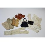 Ten various pairs of ladies’ gloves; & two evening bags.