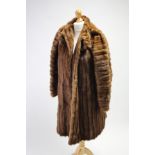 Three fur coats; two fur shoulder wraps; & two fur stoles.