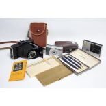 A Parker three-piece pen & pencil set (cased); an Emu Brand cigarette case, boxed; & three cameras.