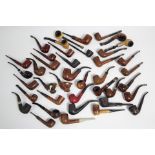 Approximately thirty various briar pipes.