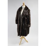 A mink fur silk-lined ladies’ three-quarter length coat, & a ditto stole.