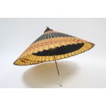 A Chinese parasol, 40” diam. x 29¾” long, slight faults.