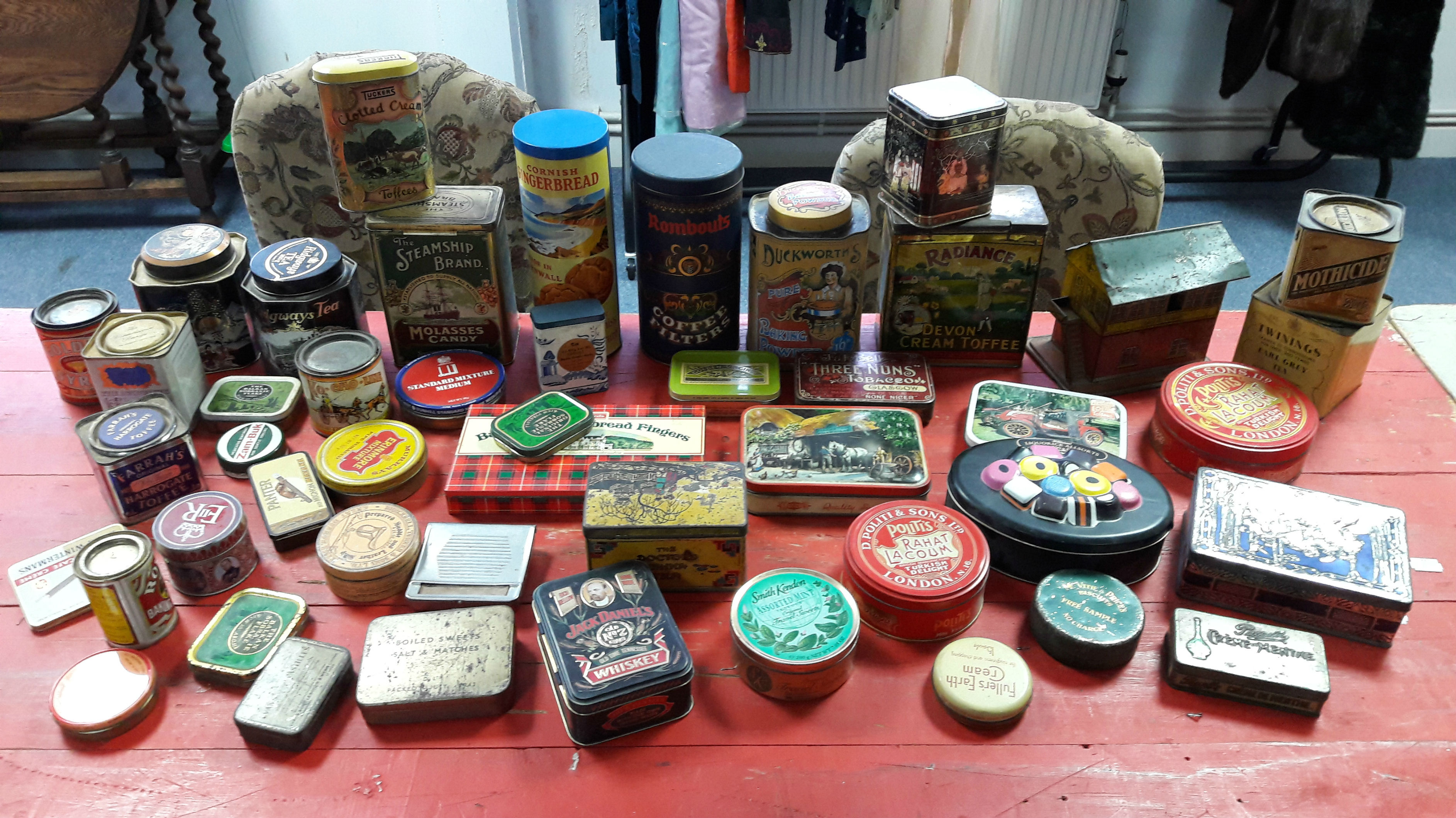 Forty-eight various advertising tins.