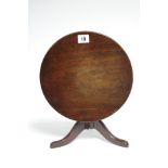 A 19th century mahogany apprentice-piece circular tilt-top dining table on turned centre column &