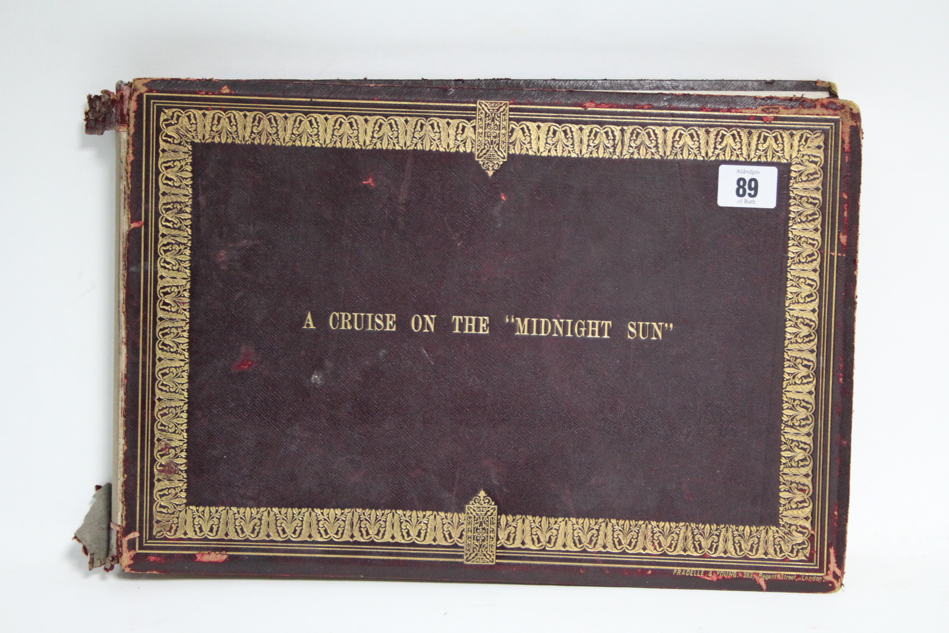 A Victorian leather-bound family photograph album titled: “A CRUISE ON THE MIDNIGHT SUN”