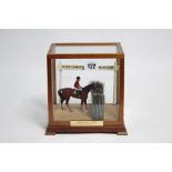 A small display of the 1986 Cheltenham Gold Cup winner Dawn Run & jockey Jonjo O’Neill, in glazed