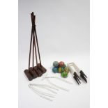 A matched croquet set comprising four mallets, seventeen hoops, eight balls, & a jack.