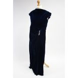 Three mid-20th century ladies’ evening dresses; an embroidered housecoat; & various other items of