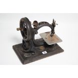 An early 20th century Willcox & Gibbs sewing machine, lacking case.