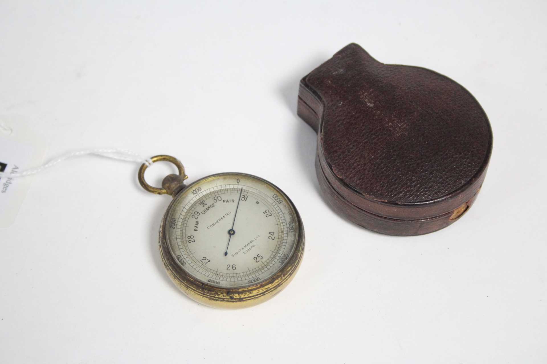 A late 19th/early 20th century compensated pocket barometer, the silvered dial signed “Short & Mason