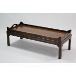 A mahogany rectangular tray-top low coffee table on short square legs, 48” x 20” (slight faults).