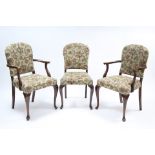 A set of six mid-20th century beech dining chairs and including a pair of carvers, with floral