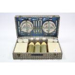 A mid-20th century Sirram picnic set in fibre covered case.