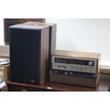 A Rotel Solid State AM/FM stereo receiver (RX-150A); an Aki stereo cassette deck (C5-30D); & a