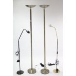 A pair of silvered-metal standard uplighters, 71¾” high; & two anglepoise standard lamps.