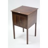 A Late 19th century inlaid-mahogany bedside cabinet enclosed by part of panel doors, and on short