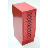 A Ryman red art-metal small office chest fitted ten long drawers, & on plinth base, 11” wide x 28”