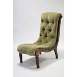 A Victorian walnut nursing chair with all-in-one buttoned seat & back upholstered green velour, & on