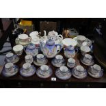 A Crown Staffordshire bone china floral decorated twenty-two piece tea service (settings for six); &