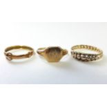 An 18ct. gold small signet ring (2.7gm); a 9ct. gold narrow belt design ring (0.5gm); & an un-marked