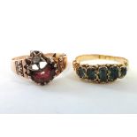 A gold ring set crescent-shaped garnet & diamond-set star; & an antique 14 carat gold ring set