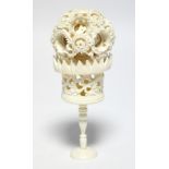 A late 19th/early 20th century Chinese carved ivory set of concentric balls, 2" diam; on slender