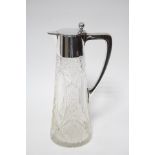 A round tapered cut glass claret jug with German .835 standard handle, neck-mount, & hinged cover;