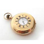 A 9ct. gold half-hunter cased gent’s pocket watch, the white enamel dial with black roman numerals &