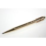 An early 20th century 9ct. gold propelling pencil by E. Baker & Son.