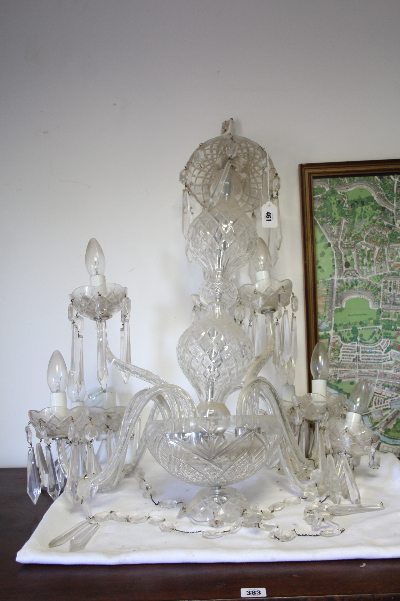 A modern Waterford cut-glass chandelier with five scroll arms hung with festoons of beads & prism