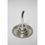 A modern wine funnel with beaded rim, shell clip, removable spout, & with matching circular stand;