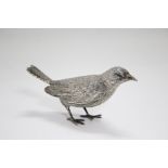 A continental cast model of a songbird, 5¼” long x 2¾” high; London import marks for 1957, & with