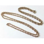 A yellow metal chain necklace of interwoven links, 26” long. (7.8gm).