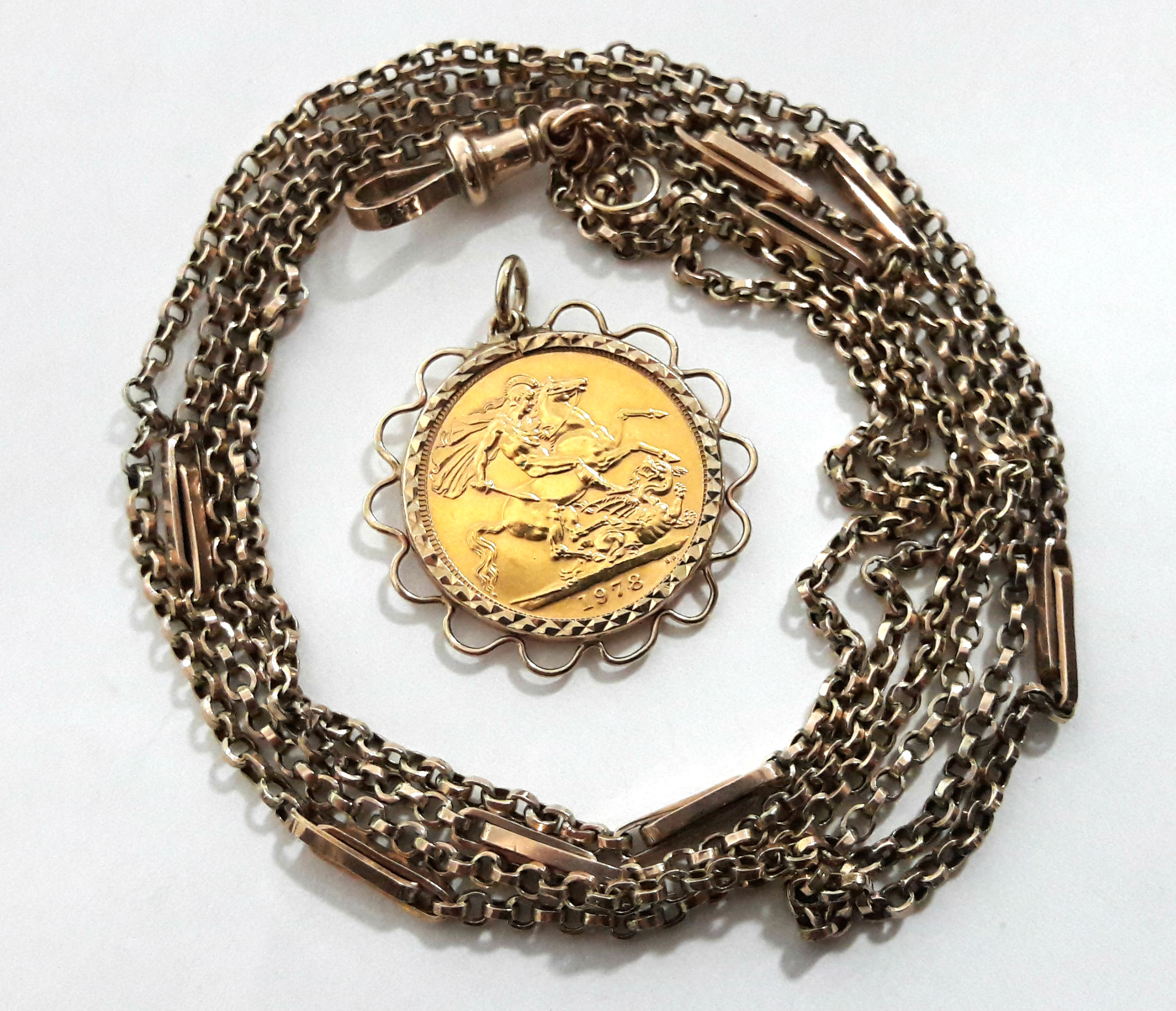 A 9ct. gold lorgnette guard (10.7gm); with pendant 1978 sovereign.
