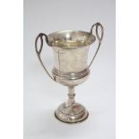 A two-handled trophy cup on round pedestal foot, 7¼” high; Birmingham 1932, by Joseph Gloster