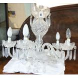 A modern Waterford cut-glass chandelier with six scroll arms & hung with prism drops; 21” wide x 24”