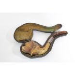 A meerschaum pipe, the bowl carved in the form of a dog’s head; 6½” long. (cased).