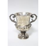 A WILLIAM IV CAMPANA-SHAPED TROPHY CUP with cast foliate handles, lobed lower part & conforming