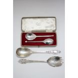 A pair of salad servers with pierced & engraved stems, London 1932, by David Landsborough Fullerton;