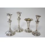 A pair of candlesticks with slender round tapered columns & circular reeded bases, 7” high,