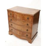 A reproduction burr-walnut serpentine-front chest fitted four long drawers with brass ring handles &