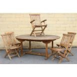 A teak extending garden table with D-shaped ends to the rectangular top, with centre leaf & on