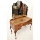 A mid-20th century burr-walnut bedroom pair comprising a kneehole dressing table, 44” wide & a