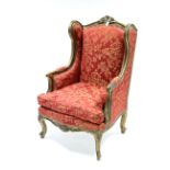 A reproduction gilt frame armchair in the continental style, upholstered crimson & bronzed floral