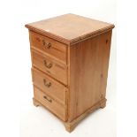 A pitch pine two-drawer filing cabinet on bracket feet, 20¼” wide x 32” high.