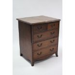 A mahogany cabinet converted from an antique commode, fitted three long drawers enclosed by hinged