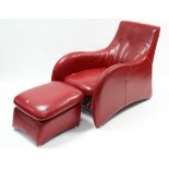 A RED LEATHER LOGE ARMCHAIR & STOOL AFTER A DESIGN BY VAN DEN BERG (slight faults).